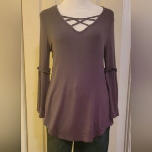 NWOT. Knit top with 3/4 bell sleeves and criss cross front